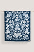 Navy blue wool blanket with a white floral pattern on a white background
