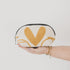 Hand holding a small pouch with a yellow heart design on a plain background